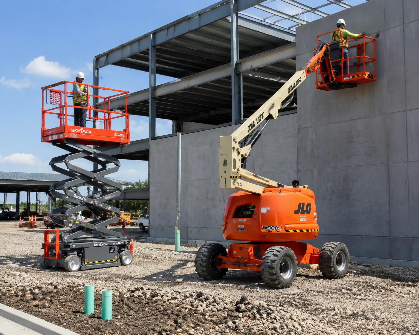 JLG 450AJ boom lift and Skyjack SJ3219 scissor lift operating on a commercial construction jobsite
